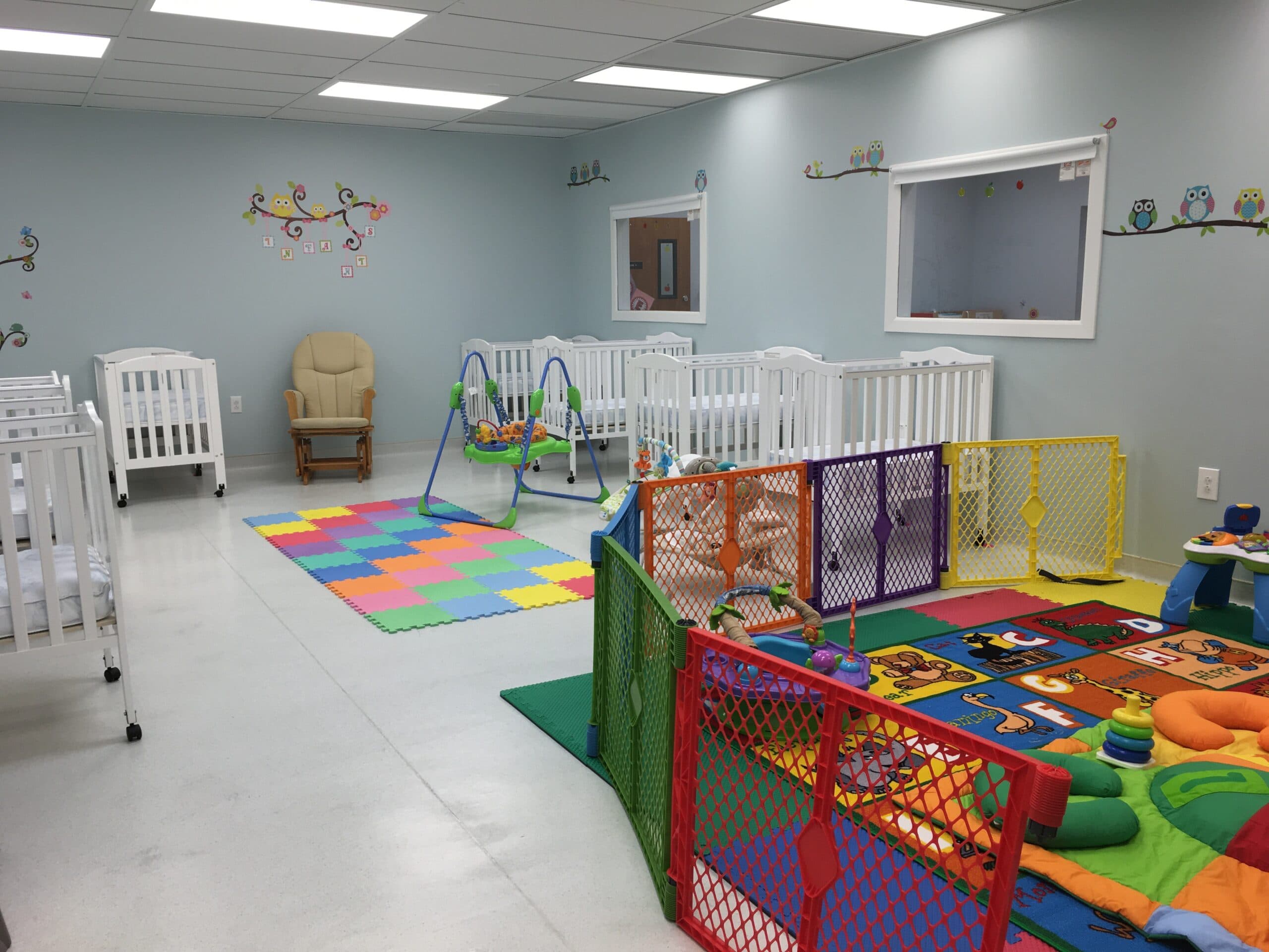 Calm infant room with soft, nurturing setup